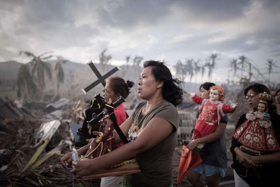  1st Prize Spot News Single    18 November 2013, Tolosa, the Philippines  Survivors of typhoon Haiyan march during a religious procession in Tolosa, on the eastern island of Leyte. One of the strongest cyclones ever recorded, Haiyan left 8,000 people dead and missing and more than four million homeless after it hit the central Philippines.