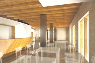 Wnętrze kawiarni i holu wejściowego Centrum Sztuki Filmowej w Chełmie. Widok w kierunku kasy i schod