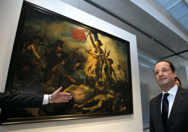 Obraz Eugenea Delacroix "Wolność wiodąca lud na barykady" (EPA/MICHEL SPINGLER)